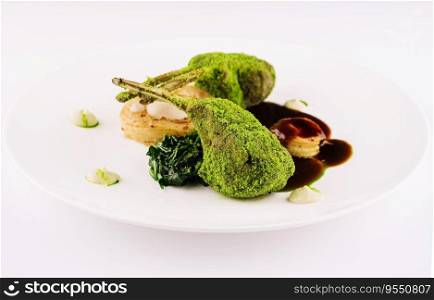Grilled rack of lamb with mint and pistachio on plate