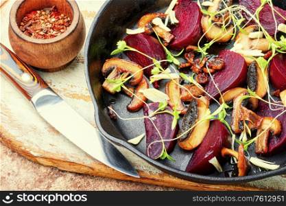 Grilled salad with beets, mushrooms, garlic and microgreens. Grilled vegetable salad.