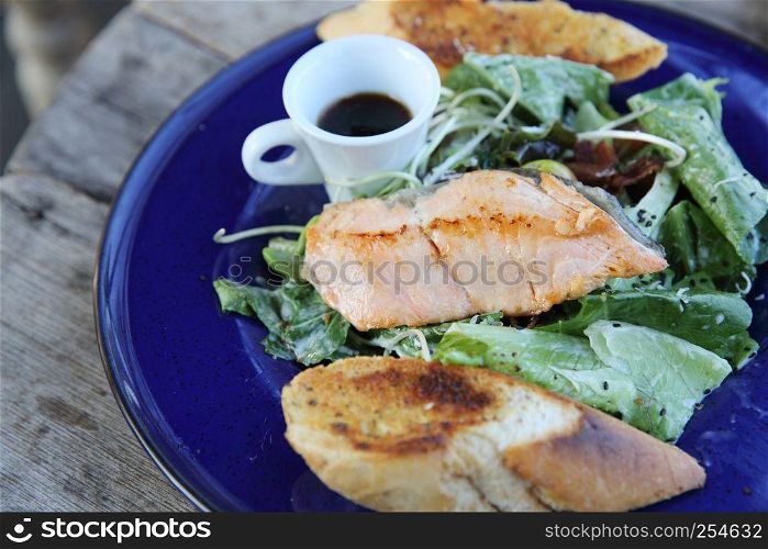 Grilled Salmon steak with salad