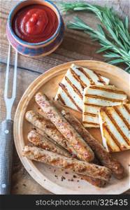 Grilled sausages and cheese with rosemary