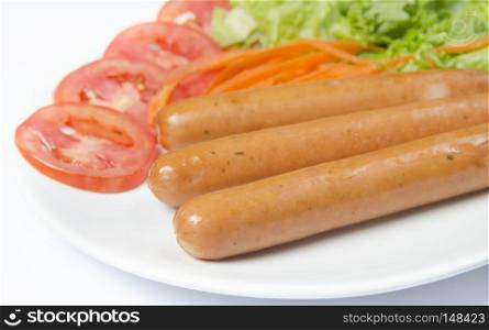 Grilled sausages and vegetables on a plate