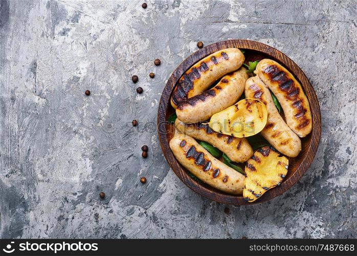 Grilled sausages fried with pear and.Autumn food.Grill menu. Grilled sausages with pear