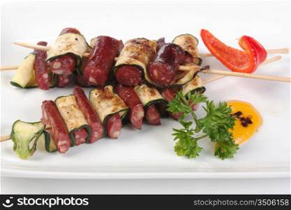 grilled sausages on wooden skewers