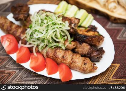 Grilled shish kebab. Grilled shish kebab or shashlik meat with vegetables