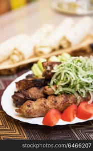 Grilled shish kebab. Grilled shish kebab or shashlik meat with vegetables