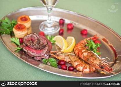 Grilled shrimps and beef meat. Grilled shrimps and beef meat on a plate