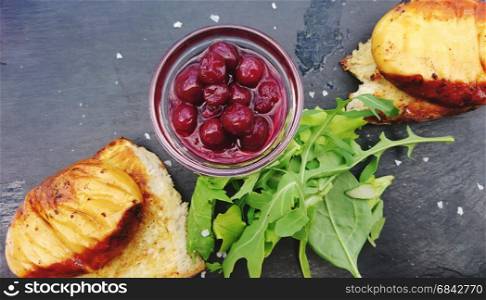Grilled Slovak sheep cheese Ostiepok with cranberries and roasted bread.
