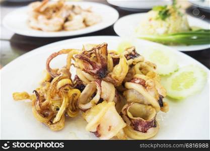 Grilled squid served in white dish ready to eat