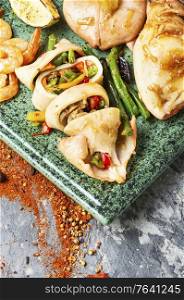 Grilled squid stuffed with vegetables.Delicious stuffed cuttlefish. Baked squid stuffed