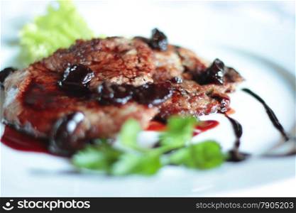 Grilled steak and vegetables. Shallow depth of field.