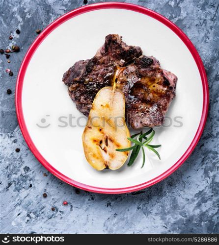 grilled steak in pear sauce. appetizing cut beef steak grill medium roast