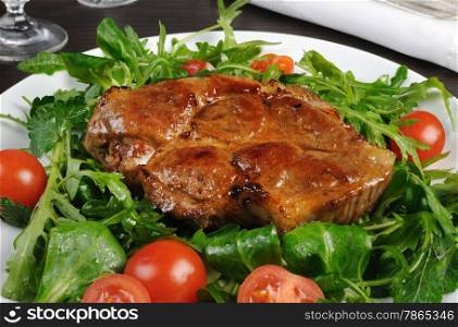 Grilled steak with bacon salad of arugula