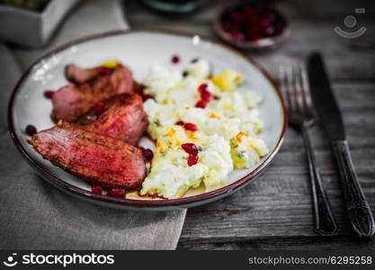 Grilled steak with cauliflower and pomegranate