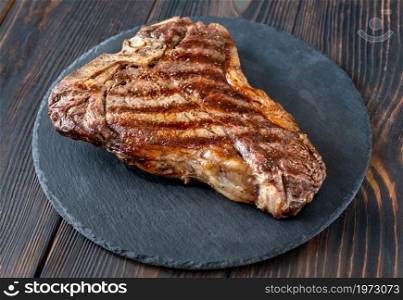 Grilled T-bone steak on the stone board