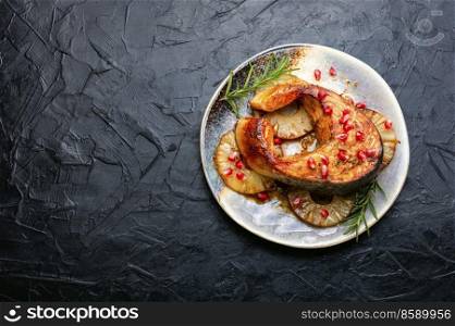 Grilled trout fish or salmon steak on pineapple. Copy space,. Grilled salmon with pineapple,space for text