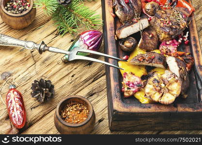 Grilled veal with vegetables.Christmas food.Beef in pomegranate sauce.Holiday food. Christmas grilled meat