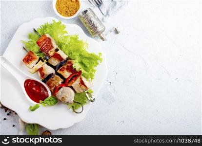 Grilled vegetable and chicken skewers with bell peppers, zucchini, onion and eggplants