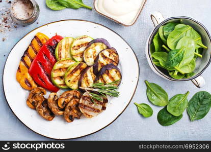 grilled vegetables with sauce on the plate, stock photo