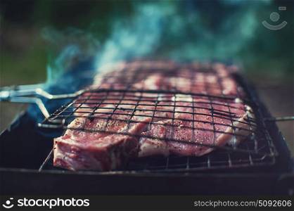 Grilling fresh entrecote pork. Grilling fresh entrecote pork on a grill