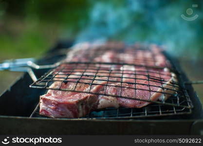 Grilling fresh entrecote pork. Grilling marinated shashlik on a grill