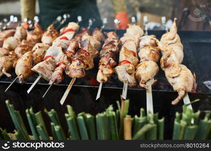 Grilling shashlik on barbecue grill with delicious meat