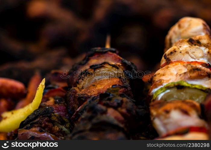 Grilling tasty food on barbecue. Steak, sausages on grill at food festival