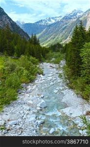 Grimsel Pass summer landscape with river and fir forest(Switzerland, Bernese Alps).