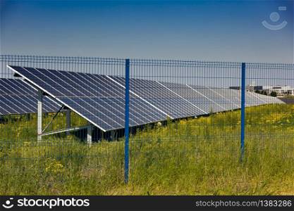 Grin clean electric power - Solar panel outside on grass photovoltaic