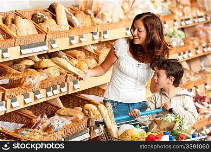 Grocery store shopping - Brown hair woman with child buying bread