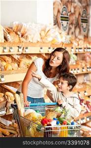Grocery store shopping - Mother with child in a supermarket