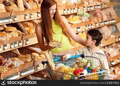 Grocery store shopping - Red hair woman with child shopping