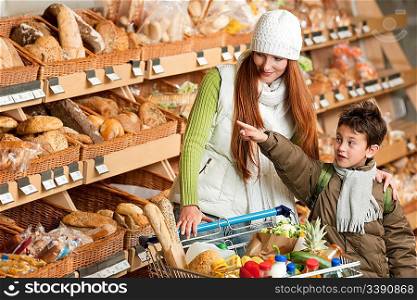 Grocery store shopping - Red hair woman with little boy choosing bread