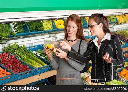 Grocery store shopping - Two business women in a supermarket