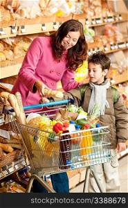 Grocery store shopping - Woman with child buying bread