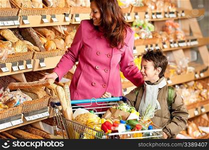 Grocery store shopping - Woman with child choosing bread