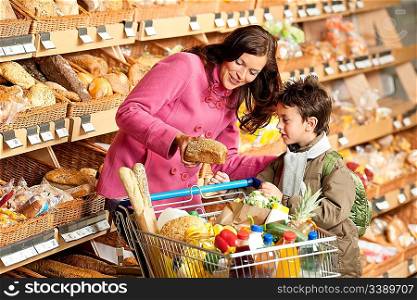 Grocery store shopping - Woman with little boy choosing bread
