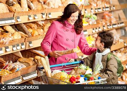 Grocery store shopping - Young woman with child in a supermarket
