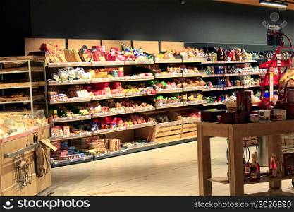 Grocery store with rich assortment of goods. Tea coffee bread. Grocery store with rich assortment of goods. Tea coffee bread. Wide choice of different product goods on shelves of supermarket