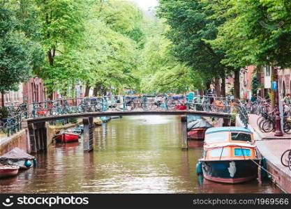 Groenburgwal canal in the old city of Amsterdam, Netherlands, North Holland province.. Beautiful canal in the old city of Amsterdam, Netherlands, North Holland province.