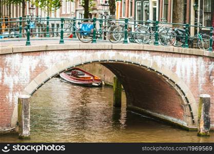 Groenburgwal canal in the old city of Amsterdam, Netherlands, North Holland province.. Beautiful canal in the old city of Amsterdam, Netherlands, North Holland province.