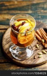 Grog. Hot drink for winter or autumn. Spicy tea and rum cocktail with lemon, cardamom, cinnamon and cloves.