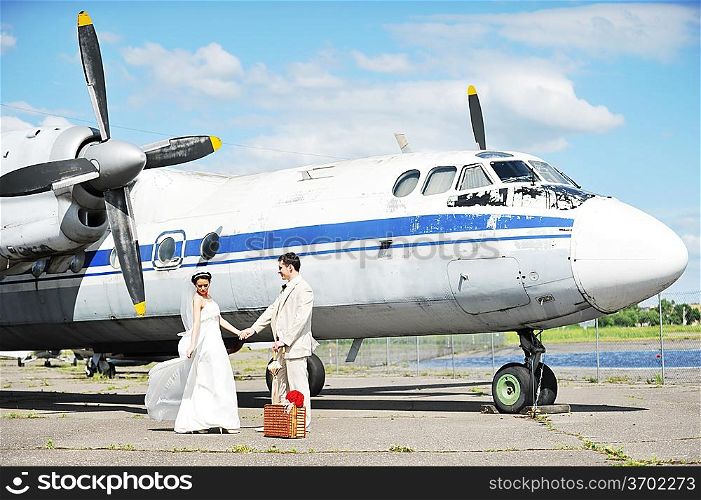 groom and bride fly to wedding travel by plane