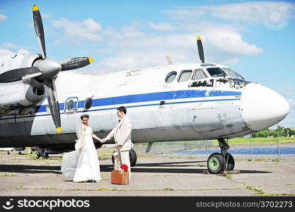 groom and bride fly to wedding travel by plane