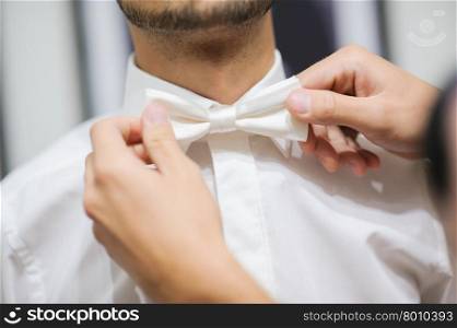 Groom is preparing for his wedding at morning