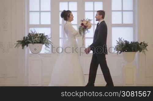 Groom meets bride, hug her in wedding day