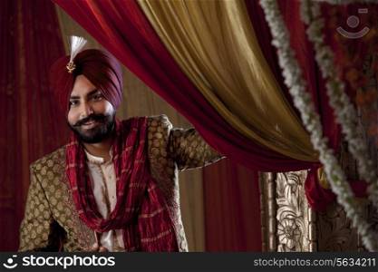 Groom wearing traditional Sikh wedding costume