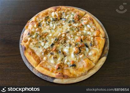 Groumet Seafood Pizza wooden table