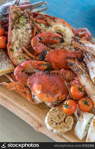 groumet seafood platter on wooden plate