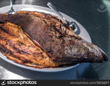 Groumet whole salmon baked with spice and herb thai style