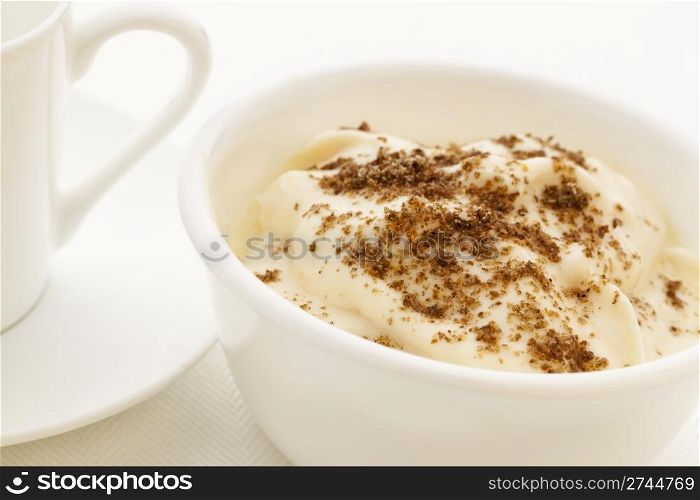 ground chia seeds sprinkled on yogurt - healthy breakfast concept